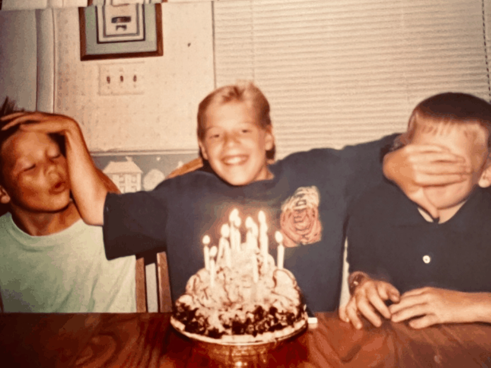 The Oyler brothers as kids, candid family moment with a birthday cake. The next generation that would carry the work forward.